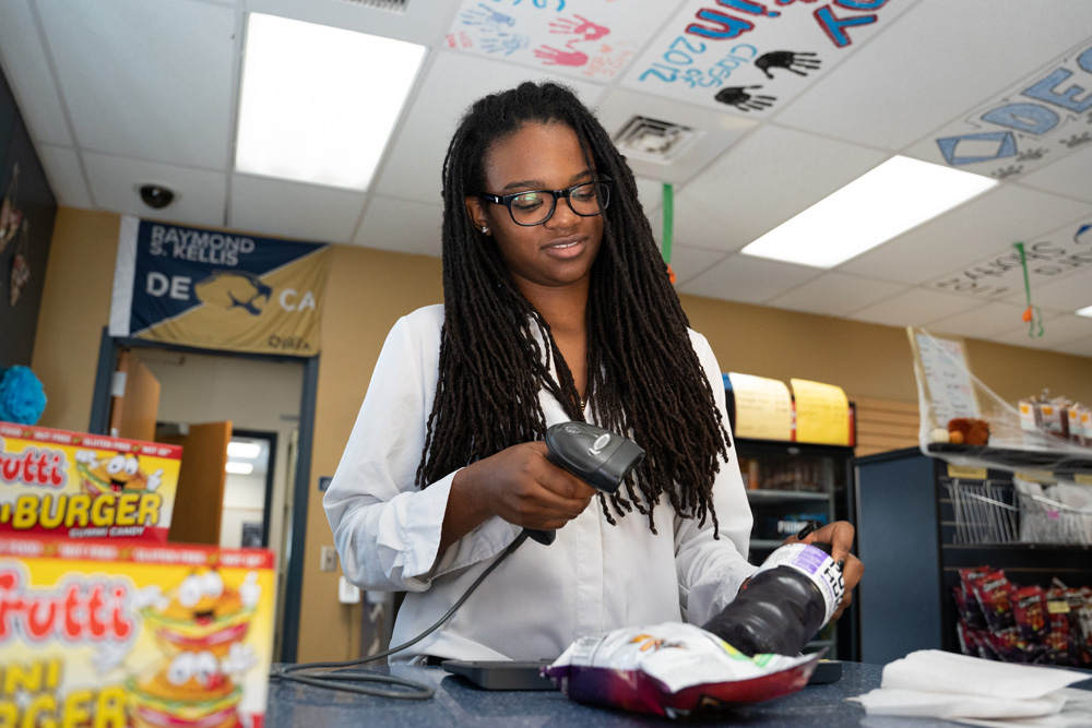 Student scanning item to sell